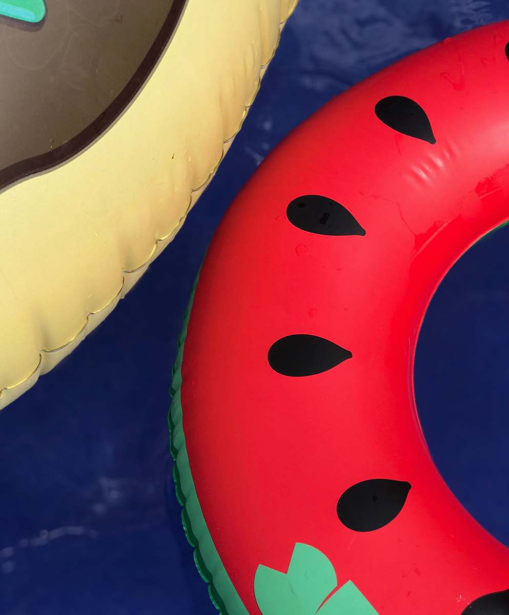 pool toy two red and yellow inflatable floaters floatation device